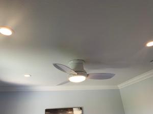 a ceiling fan with lights on a ceiling at Private bedroom and bathroom in Rancho Santa Margarita