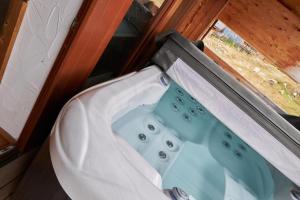 a sink in a bathroom with a window at Chalets Jasná Centrum APARTMENT S - Free Jacuzzi & Sauna and Chopok view in Belá +32 photos