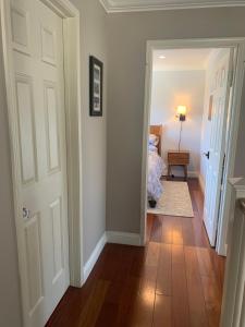 a bedroom with a bed and a hallway with a door at Private bedroom and bathroom in Rancho Santa Margarita