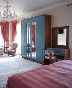 a bedroom with a blue cabinet and a bed at Comfort Villa Sheki in Sheki +33 photos