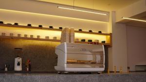 a toaster sitting on a counter in a kitchen at Oasis Living in Islamabad