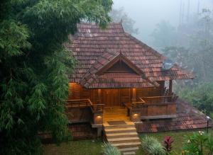 a cabin in the woods with a roof at Vythiri Palace Wayanad Pool Resort - Mist Climate & India's First Apple Infinity Pool in Vythiri