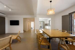 a dining room with a wooden table and chairs at Aegean Gem Villa in Mármara