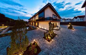 a large building with lights in front of it at Hotel Oasis in Vinnytsya