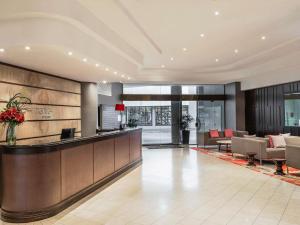 a lobby of a hotel with a reception desk at Mantra on Queen in Brisbane