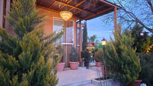 a house with christmas trees in front of it at Green Land in Tbilisi City