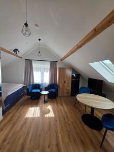 a room with a bed and a table and chairs at Modern apartment in downtown in Schwäbisch Hall