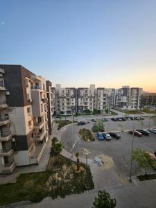 an aerial view of a parking lot in a city at Elite 3 BR Apartment in Zayed in Sheikh Zayed
