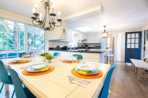 a dining room and kitchen with a table and chairs at Less than 5 Miles to Rock Harbor in Orleans +25 photos