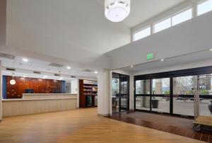 an empty lobby with a waiting area and windows at Comfort Suites Springfield-Eugene in Springfield +108 photos