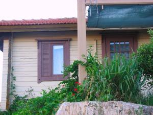 a house with a window and a rock in front of it at Ananda in Hararit +12 photos