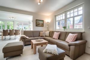 a living room with a couch and a table at Stine in Prerow