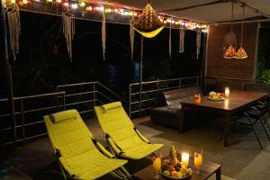 a patio with a table and chairs and lights at SAMUI BOHO Family Villa 4BR with Pool Renovated 2026 in Nathon Bay