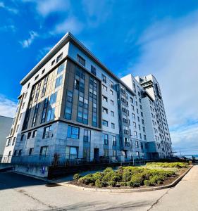a large white building with a lot of windows at Waters View in Edinburgh
