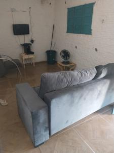a silver couch in a room with a wall at Sitio de Antonio à 18km do parque do povo in Campina Grande