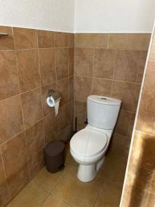 a bathroom with a toilet and a trash can at Central Stone Living in Peyia
