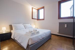 Letto o letti in una camera di Filodrammatici Loft by Welc(H)ome