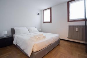 Letto o letti in una camera di Filodrammatici Loft by Welc(H)ome