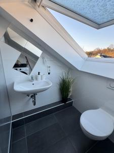 a bathroom with a sink and a toilet at Wohnung in Kirchheim in Kirchheim unter Teck