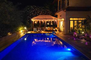 a swimming pool at night with a gazebo at SAMUI BOHO Family Villa 4BR with Pool Renovated 2026 in Nathon Bay