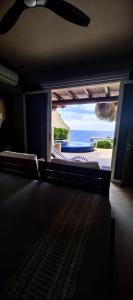 a view of a room with a view of the ocean at Oceanfront Designer Penthouse, Private Pool in Ixtapa