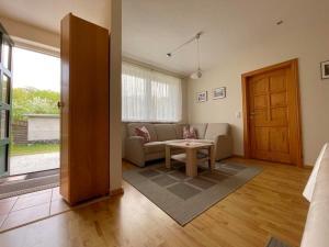 a living room with a couch and a table at Ferienwohnung Shar Pei in Thiessow