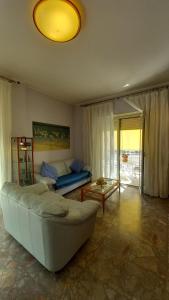 a living room with a couch and a table at Al Centro - Gaeta in Gaeta