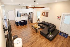 a living room with a couch and a table at Steps to Beach Private Pool 2 Big Levels in South Padre Island