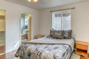 a bedroom with a bed and a window at Explore the Coconino Forest! Flagstaff Cottage in Flagstaff