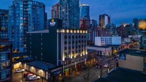 a view of a city at night with buildings at Quality Inn & Suites in Vancouver