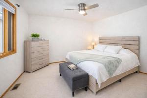 a bedroom with a large bed and a dresser at East Side 3 Br 2 full bath King Bed in Appleton
