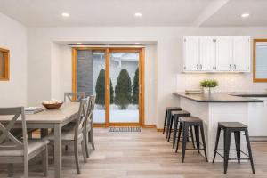 a kitchen and dining room with a table and chairs at East Side 3 Br 2 full bath King Bed in Appleton +7 photos