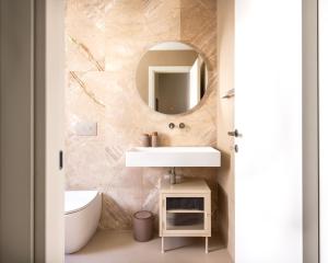 a bathroom with a sink and a mirror at Casa Marella in Balestrate +17 photos