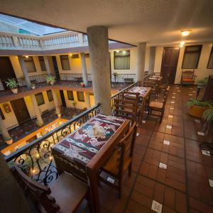 an overhead view of a restaurant with tables and chairs at Viena Internacional B&B - Rooftop in Quito