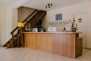 a lobby with a counter and a staircase in a room at Santa Maria del Cabo in San José del Cabo