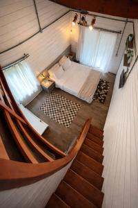 a room with a bed and a staircase in a room at Hotel Acqua Lokos in Arroio Teixeira +82 photos