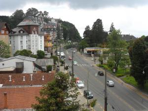 a view of a city with cars driving down a street at Suite No Centro De Gramado in Gramado