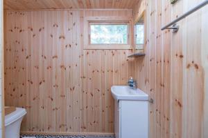 a bathroom with a sink and a toilet and a window at VMA945-Koeping-Avhulta-Gard-1 in Köping +13 photos
