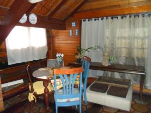 a dining room with a table and chairs at Suite No Centro De Gramado in Gramado +16 photos