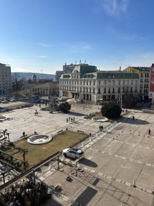 a large plaza in a city with buildings at Snug apartament in Iaşi +7 photos