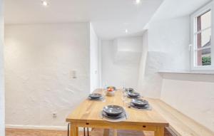 a room with a wooden table with plates on it at Munkler Mühle Whg 1 in Irrhausen