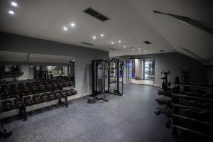 a gym with lots of equipment in a room at Fafa Sun Hotel - Adults Only in Golem