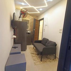 a living room with a couch and a television at Luna home in Petra