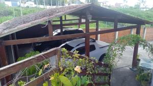 a car is in the middle of a garage at Chalé Privê Serrano em Gravatá in Gravatá