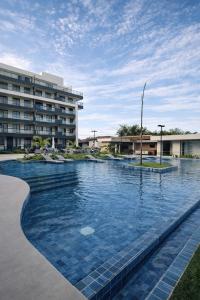 a large swimming pool in front of a building at Refúgio Serena in Niterói