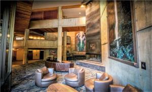 a lobby with couches and chairs in a building at Condo Right on the Snowbird Slopes! in Sandy