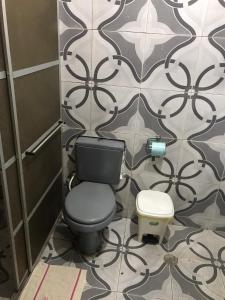 a bathroom with a toilet and a wall at casa boa vista in Recife +21 photos