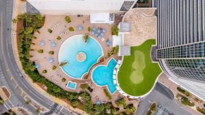 an overhead view of a swimming pool in a city at Steps to the Sand - 1BR Condo in Panama City Beach