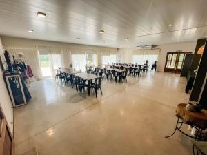 a large banquet hall with tables and chairs at Hotel BIOCERRO in Tandil