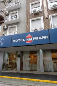 a hotel inn miami sign in front of a building at Hotel Miami in Mar del Plata +1 photo